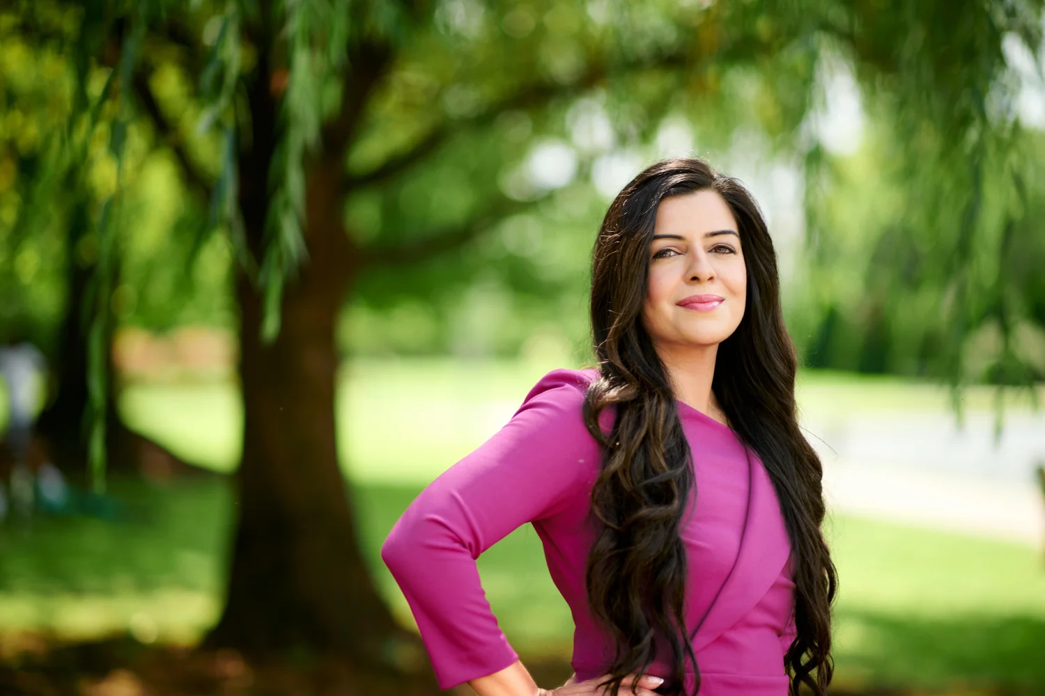 Meriam Sabih outdoors beneath a willow tree